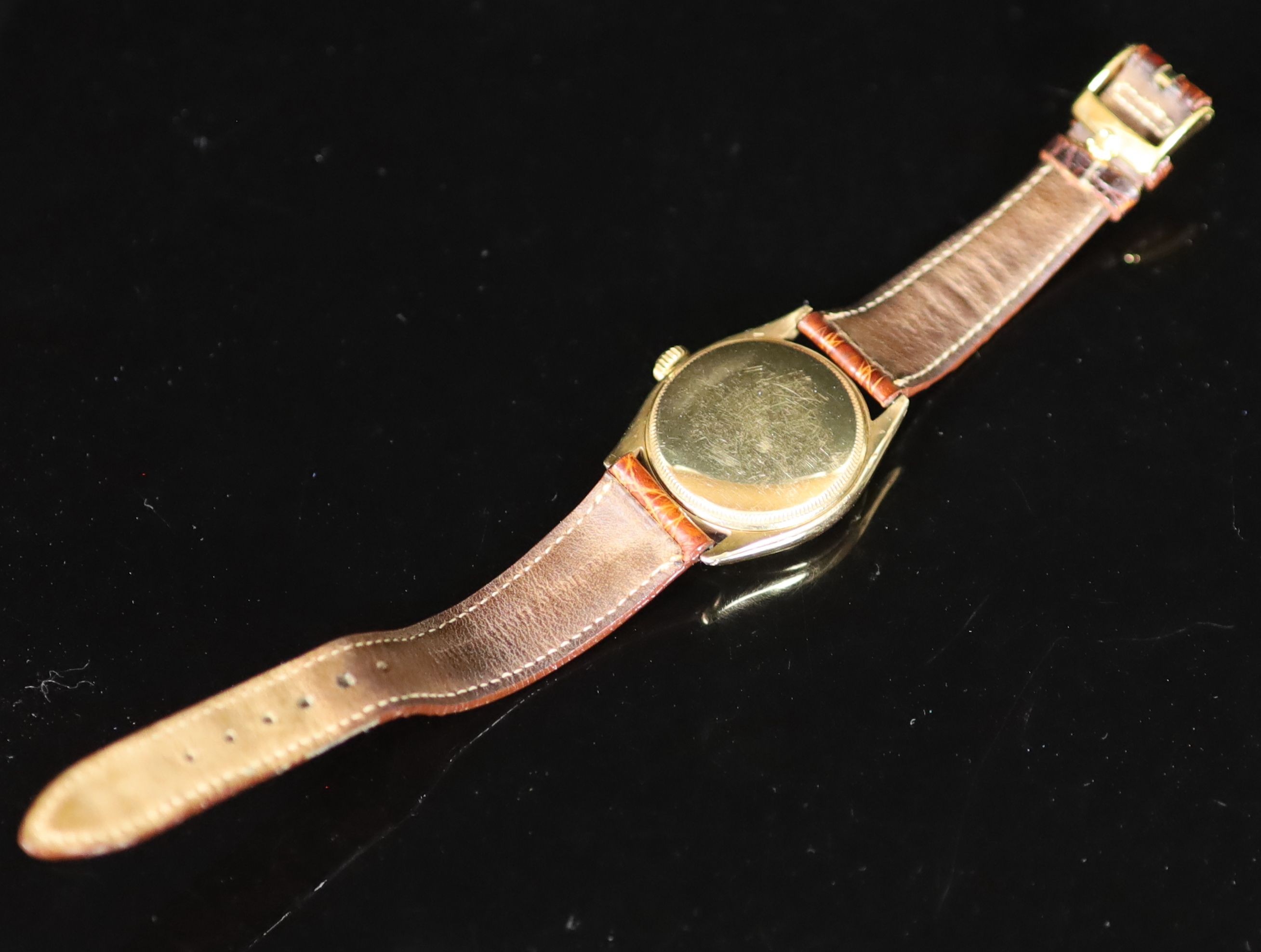 A gentleman's early 1950's 9ct gold Rolex Oyster Perpetual bubbleback wrist watch, on a leather strap with gold plated Rolex buckle